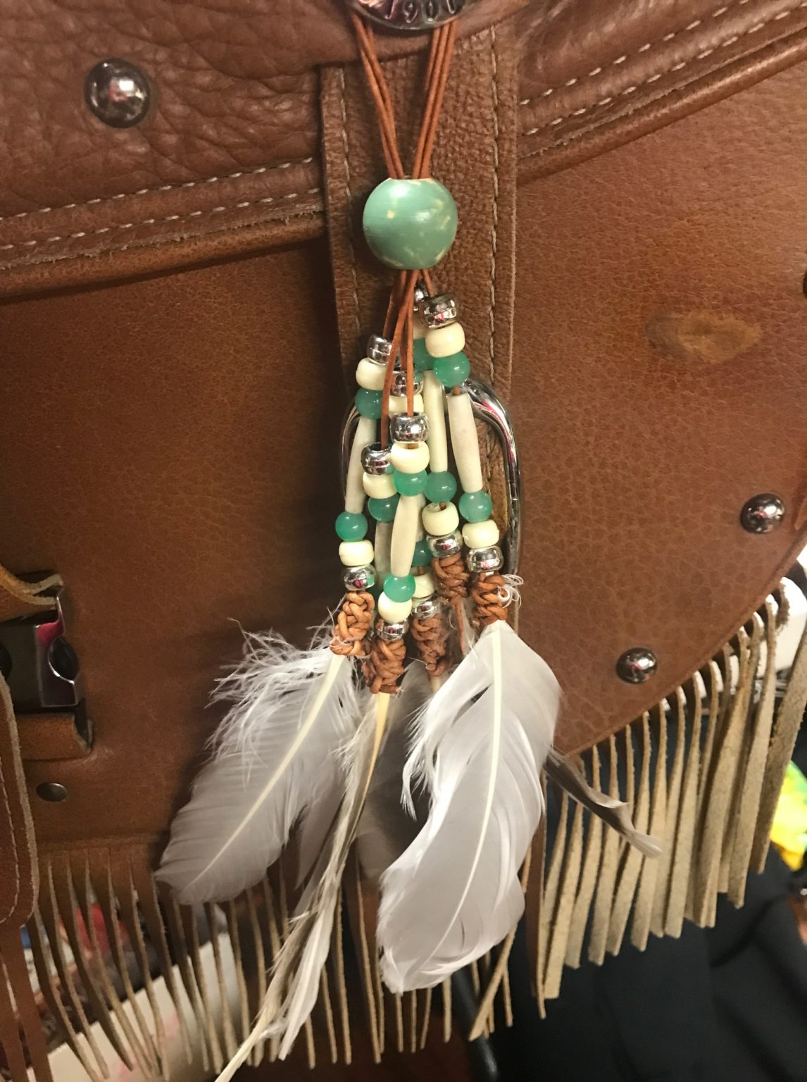 Willow Green and Ivory Feathered Conchos for seats and saddlebags